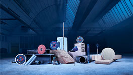 Bosch Professional tools arranged on wooden boards and metal pipes.