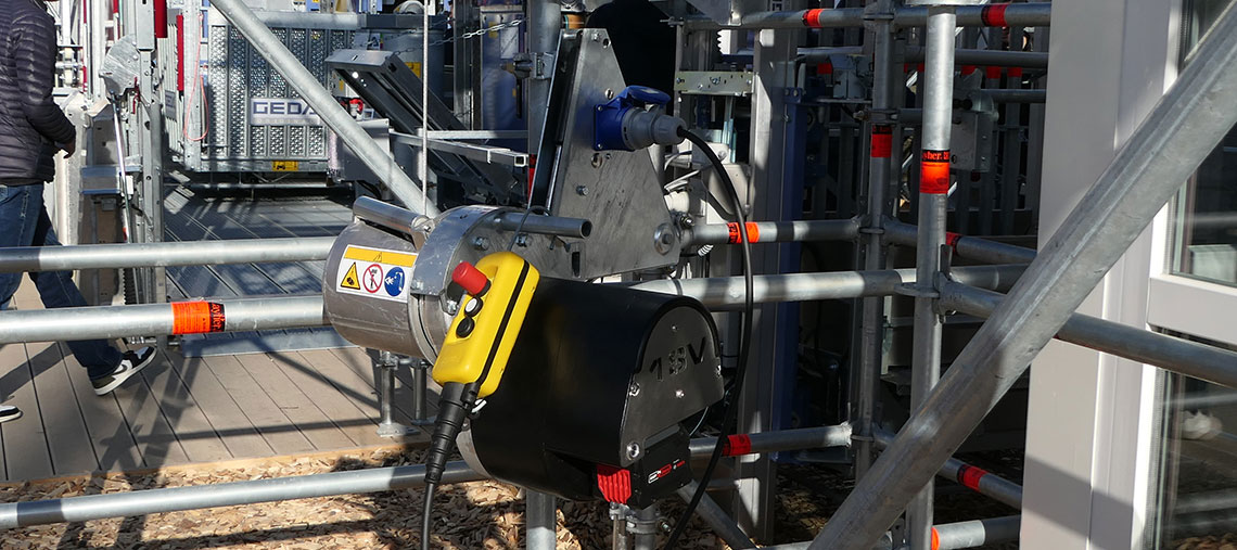 A yellow Bosch Professional tool with controls on a scaffold.