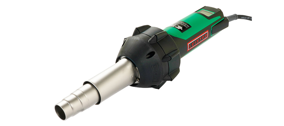A green Bosch Professional heat gun is lying on a white background.