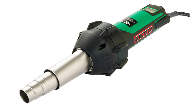 A green hairdryer lies on a white background.