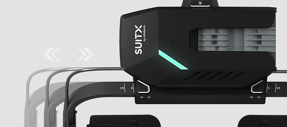 A black SUITX tool attachment with a green LED display on a gray background.