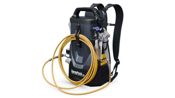 A black Bosch Professional spray device with a yellow hose is ready.
