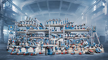 Various Bosch Professional tools in a modern warehouse.
