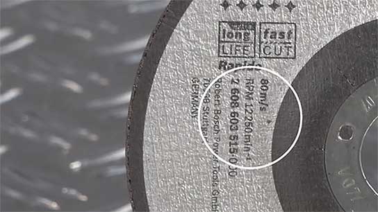 A Bosch Professional cutting disc with technical specifications on the surface.