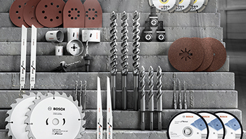 Various Bosch Professional tools arranged on a gray background.