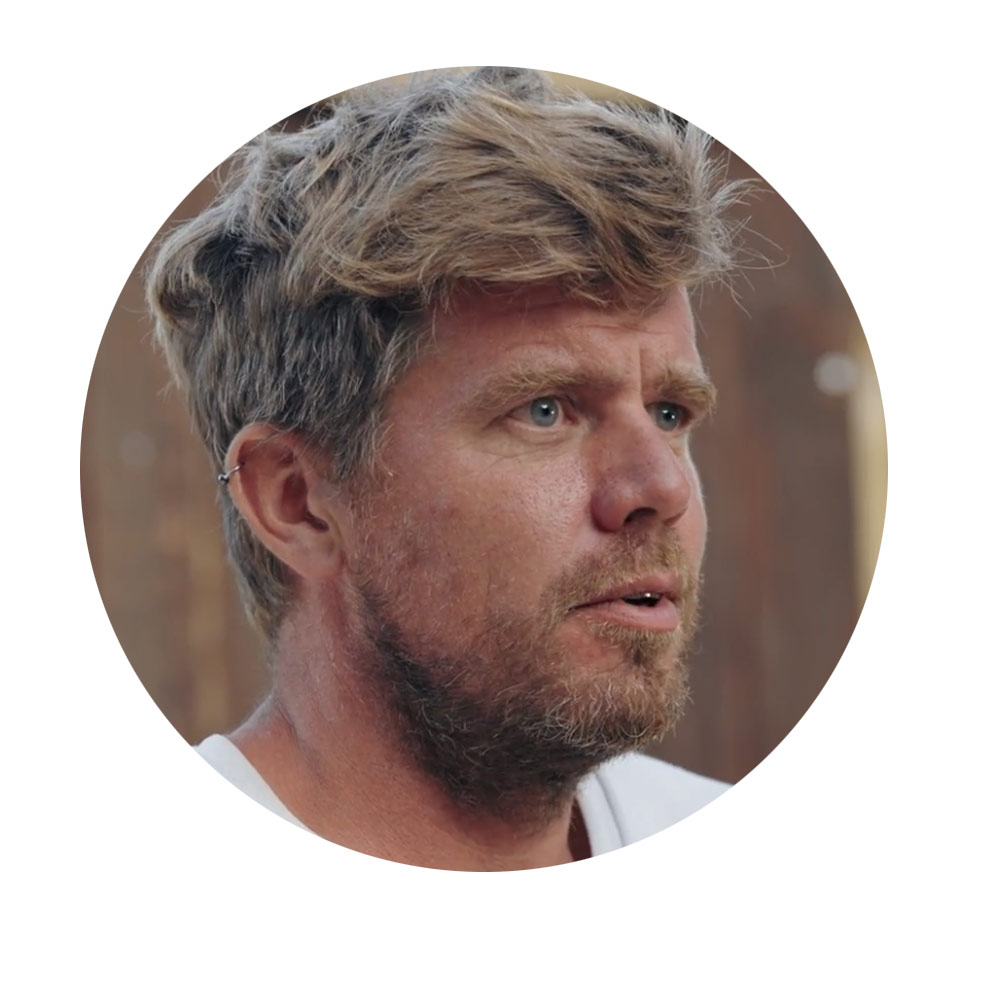 Nils Ortmann, Construction Manager A man with blonde hair and a beard looks thoughtfully.