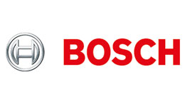 Bosch Professional tools on a table, arranged in various colors.